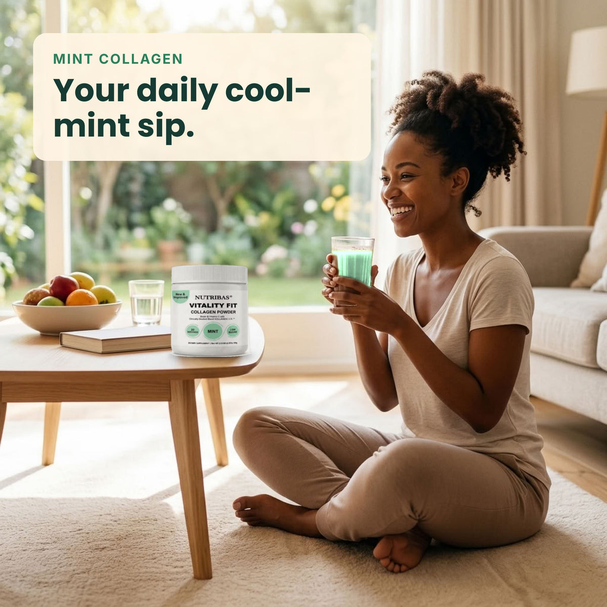 A woman sits cross-legged on a beige rug in a bright living room, holding a mint green drink. A white tub of NutriBloom Vitality Fit mint collagen drink is placed on a wooden coffee table beside her, with a promotional text overlay in the top left corner.