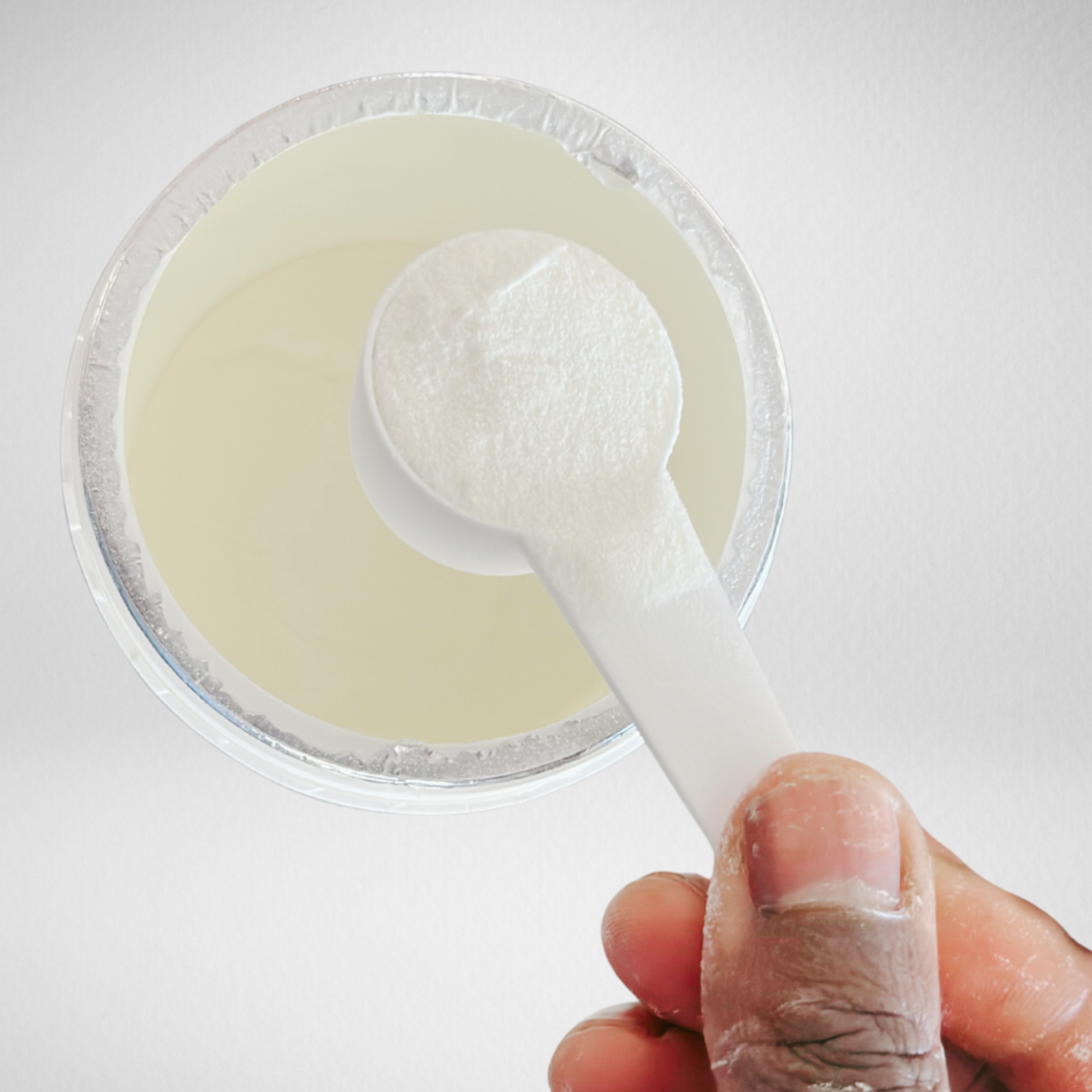 white collagen powder showing in an open Unflavored Grass-Fed Multi Collagen Peptides Chocolate Protein Powder with Biotin, Vitamin C, Hyaluronic Acid & MCT Oil bottle